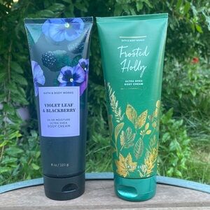 Two bottles of Bath and Body Works Body Cream